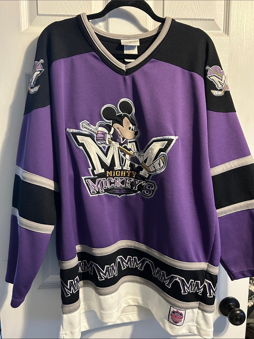 Disney Mighty Mickey’sPurple and Black V-Neck Hockey Jersey.
